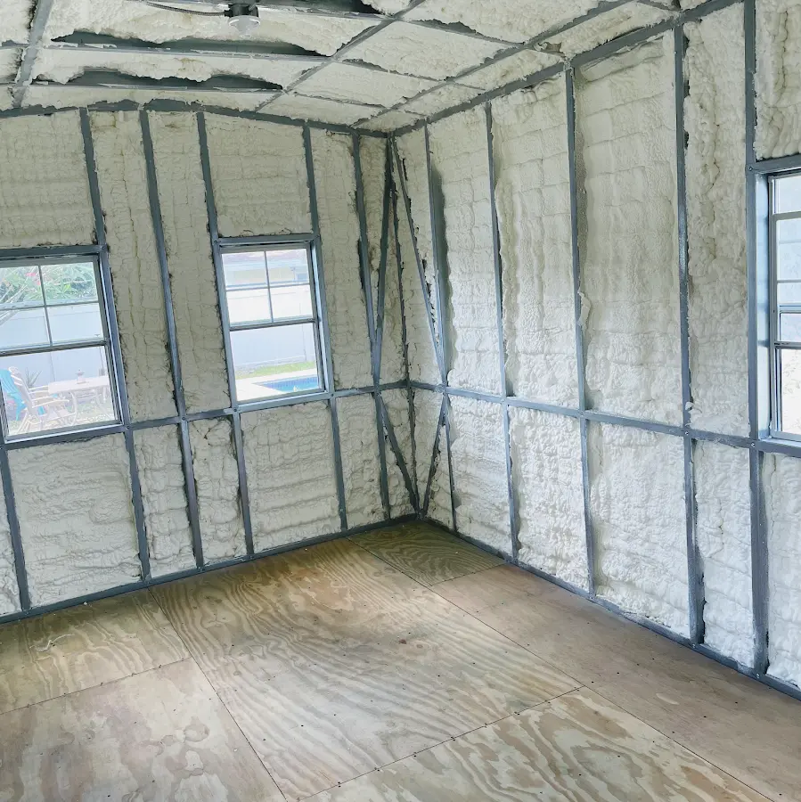 Closed-cell spray foam insulation applied to wall cavities in a residential project in Waller